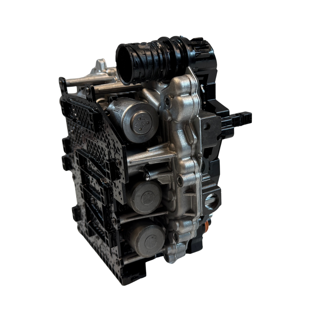 Top-side detail image of a 0BH mechatronic unit with visible hydraulic and electronic sections
