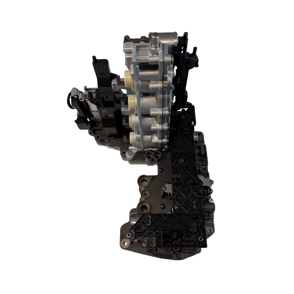 Top-side detail image of a 0B5 mechatronic unit with visible electronic and hydraulic sections