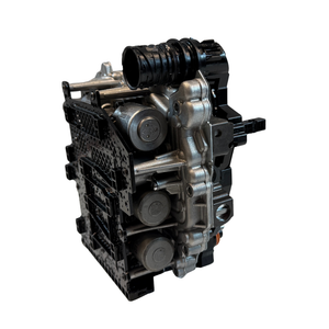 Top-side detail image of a 0BH mechatronic unit with visible hydraulic and electronic sections